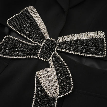 Beautiful jacket with bow decorated with diamonds.