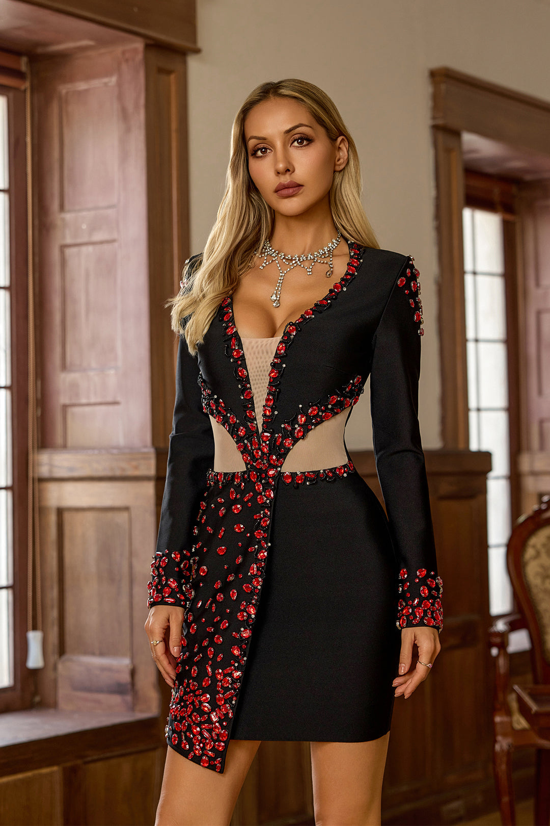 Ruby Beautiful black dress with decoration in red stones.